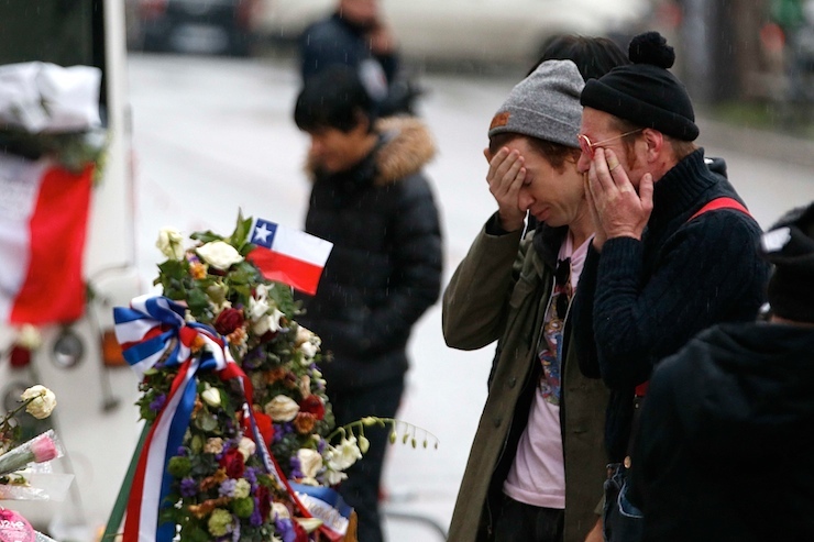 Jesse Hughes and Julian Dorio, members of Eagles of Death Metal band, mourn in front of the Bataclan concert hall to pay tribute to the shooting victims in Paris