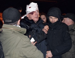 Lutsenko receives medical help after clashes with riot police near a court in Kiev