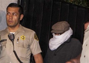 File photo of Nakoula Basseley Nakoula escorted out of his home by Los Angeles County Sheriff's officers in Cerritos, California