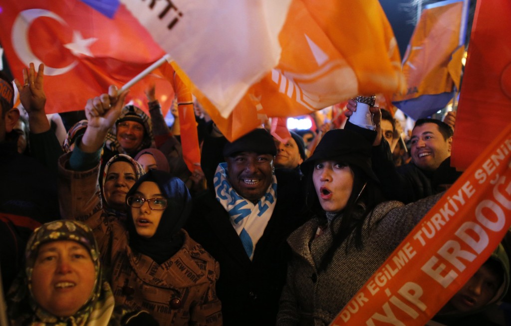 Supporters of Turkey's Prime Minister Tayyip Erdogan celebrate their election victory in Ankara