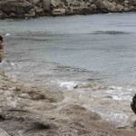 A rebel fighter poses for a photograph at the beach of al-Samra in Latakia province near the town of Kasab