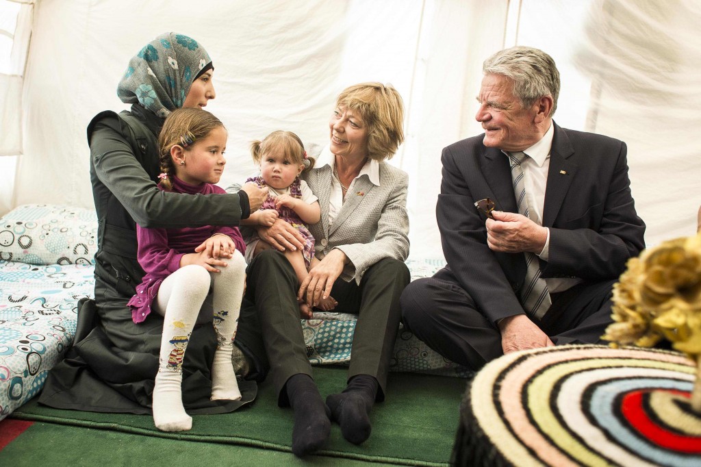 Germany's President Gauck and partner Schadt meet a Syrian refugee family in a refugee camp in Kahramanmaras