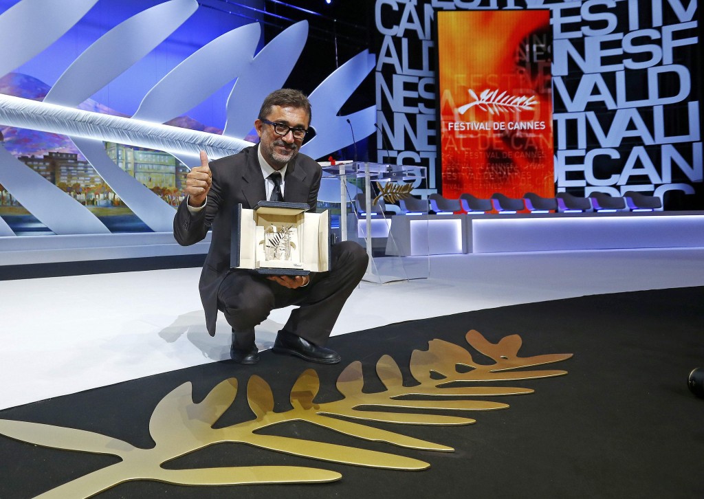Director Nuri Bilge Ceylan, Palme d'Or award winner for his film "Winter Sleep", poses on stage during the closing ceremony of the 67th Cannes Film Festival in Cannes