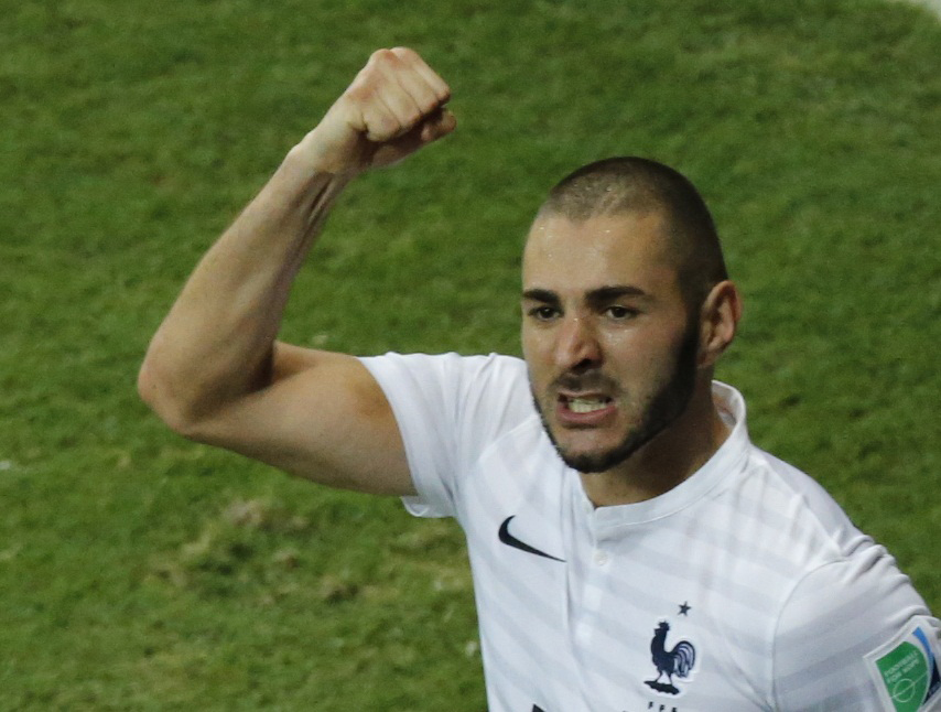France's Karim Benzema celebrates after scoring a goal with his teammates during their 2014 World Cup Group E soccer match against Switzerland at the Fonte Nova arena in Salvador