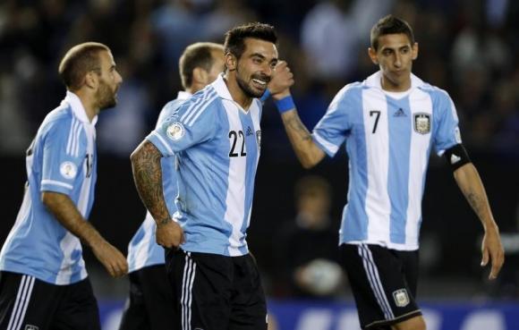 Argentina's Ezequiel Lavezzi celebrates his second goal with teammates in their 2014 World Cup qualifying soccer match against Peru in Buenos Aires