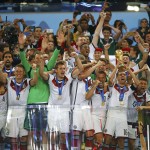Germany's players celebrate with the trophy after winning their 2014 World Cup final against Argentina at the Maracana stadium in Rio de Janeiro