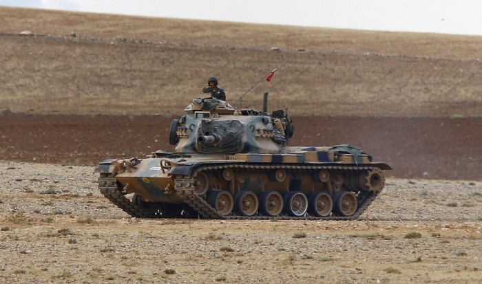 A Turkish army tank takes up position on the Turkish-Syrian border near Suruc