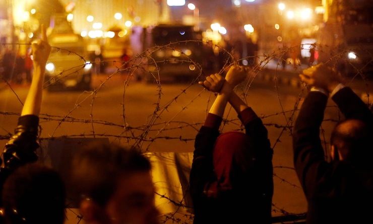 Anti-Mubarak protesters gesture after former Egyptian President Hosni Mubarak's verdict in Cairo