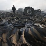 Emergencies Ministry member walks at a site of a Malaysia Airlines Boeing 777 plane crash near the settlement of Grabovo in the Donetsk region