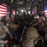 U.S. Marines are seen on board a helicopter at Kandahar air base upon the end of operations for the Marines and British combat troops in Helmand