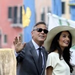 U.S. actor George Clooney and his wife Amal Alamuddin arrive at Venice city hall for a civil ceremony to formalize their wedding in Venice