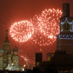 Fireworks light the sky over St. Basil's Cathedral and Kremlin's Spasskaya Tower, covered by scaffolding, during celebrations of New Year's Day in Red Square in Moscow