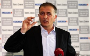 Zaman editor-in-chief Dumanli talks during a news conference at the headquarters of Zaman daily newspaper in Istanbul