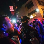 Protester, demanding justice for the death of Eric Garner, shouts towards police at a roadblock along the West Side Highway in Manhattan, New York