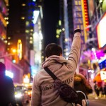 A demonstrator raises a fist during a protest in midtown Manhattan in New York