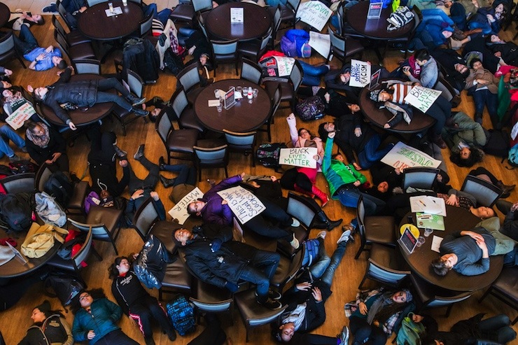 Student activists stage a 'die-in' as part of the nationwide "Hands up, walk out" protest, at Washington University in St. Louis