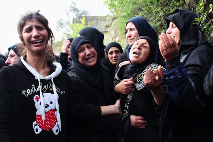 Mother and family members of Lebanese army soldier Ali Mohammad, killed in ambush in Ras Baalbek when gunmen killed at least six Lebanese soldiers, mourn during funeral in hometown of Habshit in Akkar