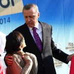 Turkey's President Tayyip Erdogan talks with students of Tevfik Ileri Imam Hatip School during its opening ceremony in Ankara