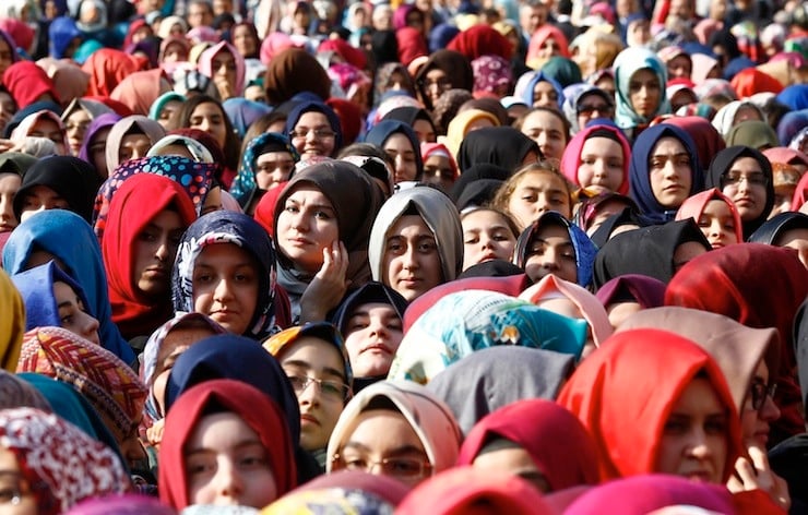 Students of Tevfik Ileri Imam Hatip School wait for the arrival of President Tayyip Erdogan for the opening ceremony in Ankara