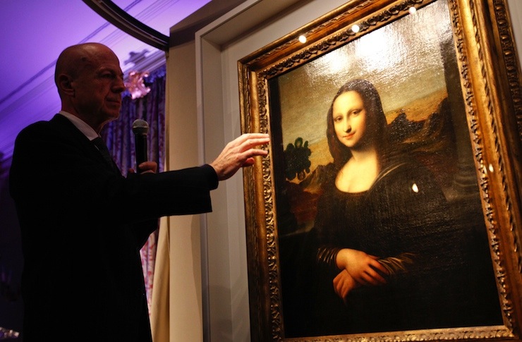 File picture of professor Alessandro Vezzosi pointing to details on a painting attributed to Leonardo da Vinci and representing Mona Lisa during a presentation in Geneva