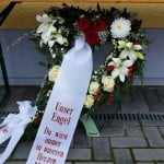 A wreath with text 'Our angel you will always remain in our hearts' is placed outside the mosque before a memorial service for late student Tugce A. in Waechtersbach