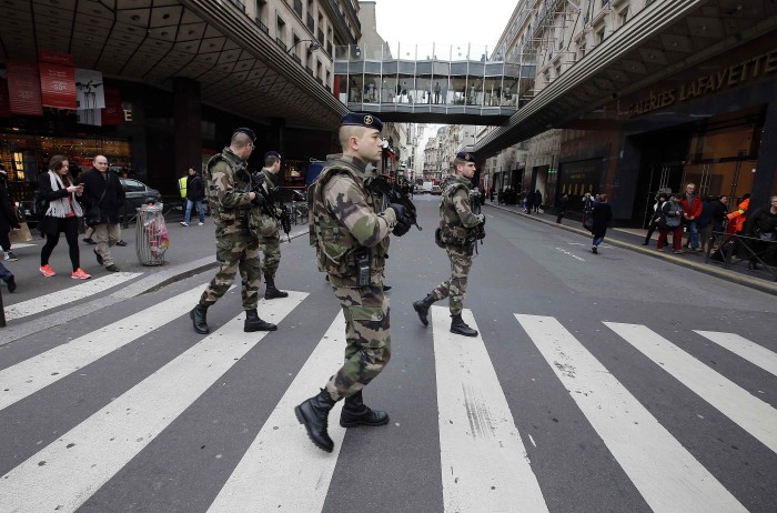 French soldiers patrol in the street near a department store in Paris as part of the highest level of "Vigipirate" security plan after a shooting at the Paris offices of Charlie Hebdo