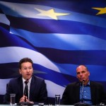 Dijsselbloem,  head of the euro zone finance ministers' group, addresses journalists as Greek Finance Minister Varoufakis  looks on  during  a common press conference at the ministry in Athens