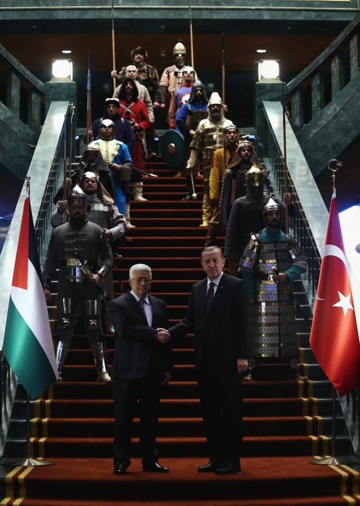 Turkey's President Tayyip Erdogan shakes hands with Palestinian President Mahmoud Abbas during a welcoming ceremony at the Presidential Palace in Ankara
