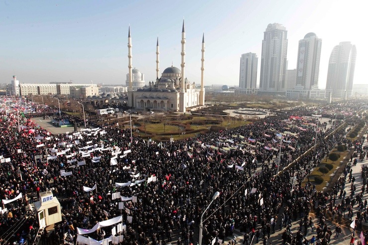People attend a rally to protest against satirical cartoons of prophet Mohammad, in Grozny, Chechnya