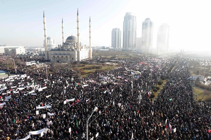 People attend a rally to protest against satirical cartoons of prophet Mohammad, in Grozny, Chechnya