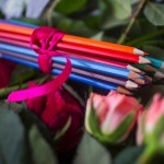 Pencils and flowers of condolance are placed at the French embassy at Pariser Platz in Berlin