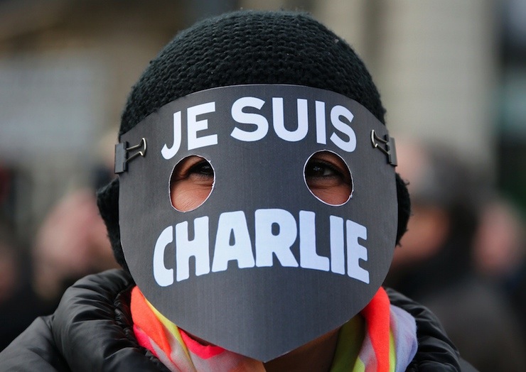 A women wearing a mask reading "I am Charlie" takes part in a solidarity march (Marche Republicaine) in the streets of Paris