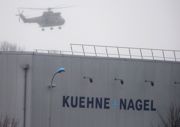 A helicopters with French intervention forces hovers above the scene of a hostage taking at an industrial zone in Dammartin-en-Goele, northeast of Paris