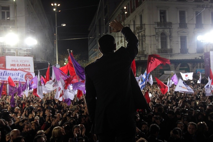 Alexis Tsipras, opposition leader and head of radical leftist Syriza party, waves to supporters during an election rally in Athens
