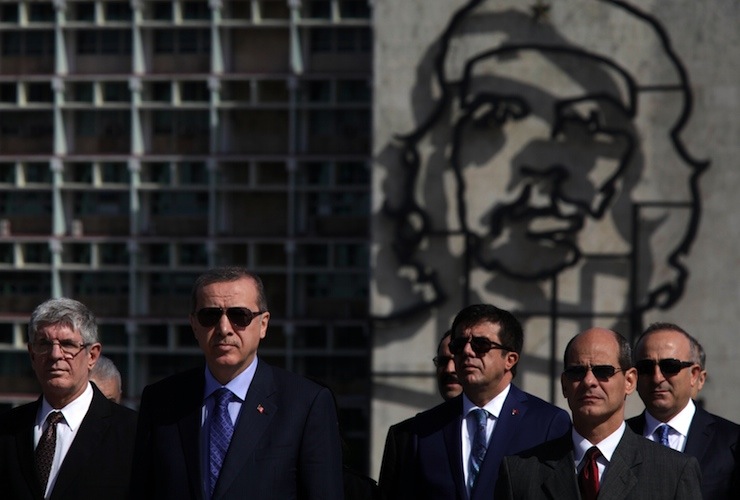 Turkey's President Recep Tayyip Erdogan stands with Cuba's Deputy Foreign Minister Rogelio Sierra during a wreath-laying ceremony at the Jose Marti monument in Havana