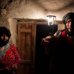 Villager Ali and his mother pose for a photograph in his front room at Ait Sghir village in the High Atlas region of Morocco