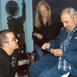 Former Cuban President Fidel Castro talks to President of Cuba's University Students Federation Randy Perdomo as Castro's wife Dalia looks on during a meeting in Havana