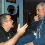 Former Cuban President Fidel Castro talks to President of Cuba's University Students Federation Randy Perdomo during a meeting in Havana