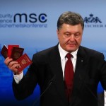 Ukraine's President Poroshenko holds Russian passports to prove the presence of Russian troops in Ukraine as he addresses during the 51st Munich Security Conference in Munich
