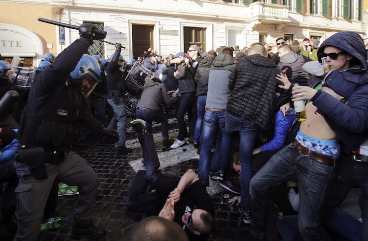 Feyenoord fans clash with police at the Spanish Steps prior to the start of the Europa League soccer match between Roma and Feyenoord in Rome
