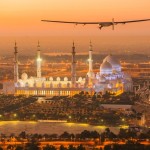 The Solar Impulse 2, a solar-powered plane, flies over the Sheikh Zayed Grand Mosque in Abu Dhabi