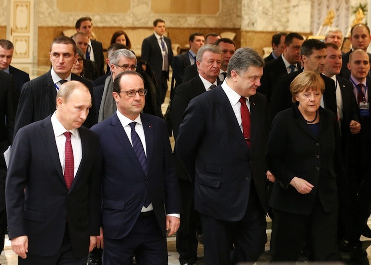Russia's President Putin, Ukraine's President Poroshenko, Germany's Chancellor Merkel and France's President Hollande walk during peace talks in Minsk