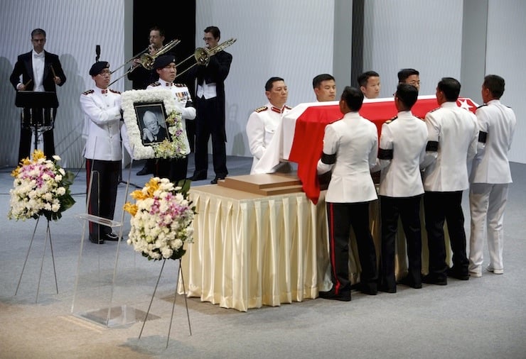 Pallbearers carry the casket of former leader Lee Kuan Yew as they depart for the final journey to the crematorium at the University Cultural Centre at the National University of Singapore