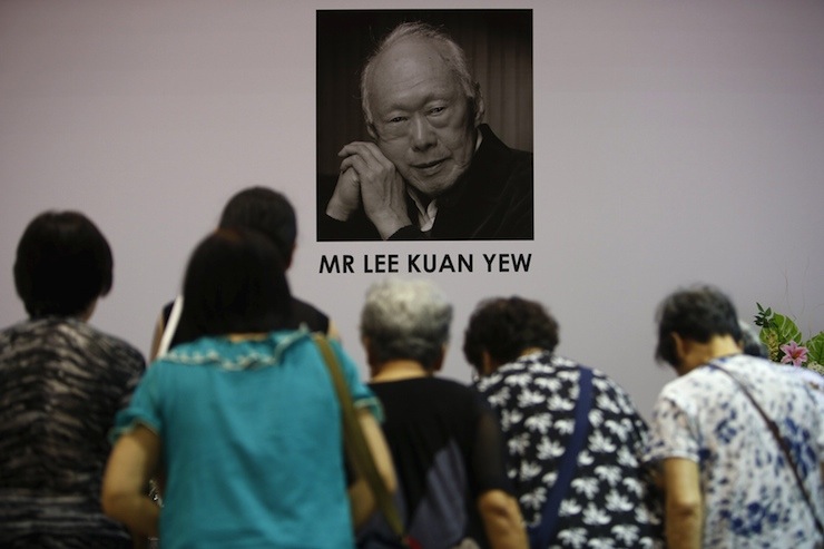 People bow as they pay their respects to the late former prime minister Lee Kuan Yew at Tanjong Pagar community club, in the constituency which Lee represented as Member of Parliament since 1955, in Singapore