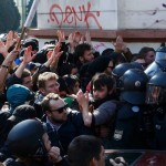 Anti-capitalist protesters scuffle with policemen near the ECB building before the official opening of its new headquarters in Frankfurt