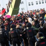 Policemen stand in front of 'Blockupy' anti-capitalist protesters near the ECB building before the official opening of its new headquarters in Frankfurt