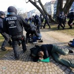 Policemen detain members of 'Blockupy' anti-capitalist movement near the ECB building before the official opening of its new headquarters in Frankfurt