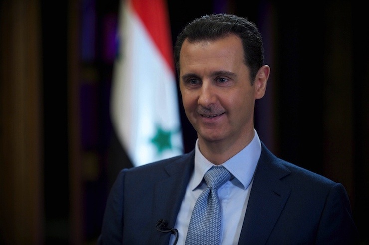 Syria's President Bashar al-Assad is seen during the filming of an interview with the BBC, in Damascus