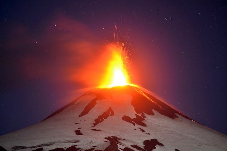 Smoke and lava spew from the Villarrica volcano as seen from Pucon town south of Santiago