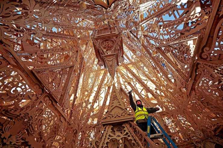 A lighting technician puts the finishing touches to Temple, a cross-community arts project that aims to demonstrate the transformative power of the arts in Londonderry, Northern Ireland